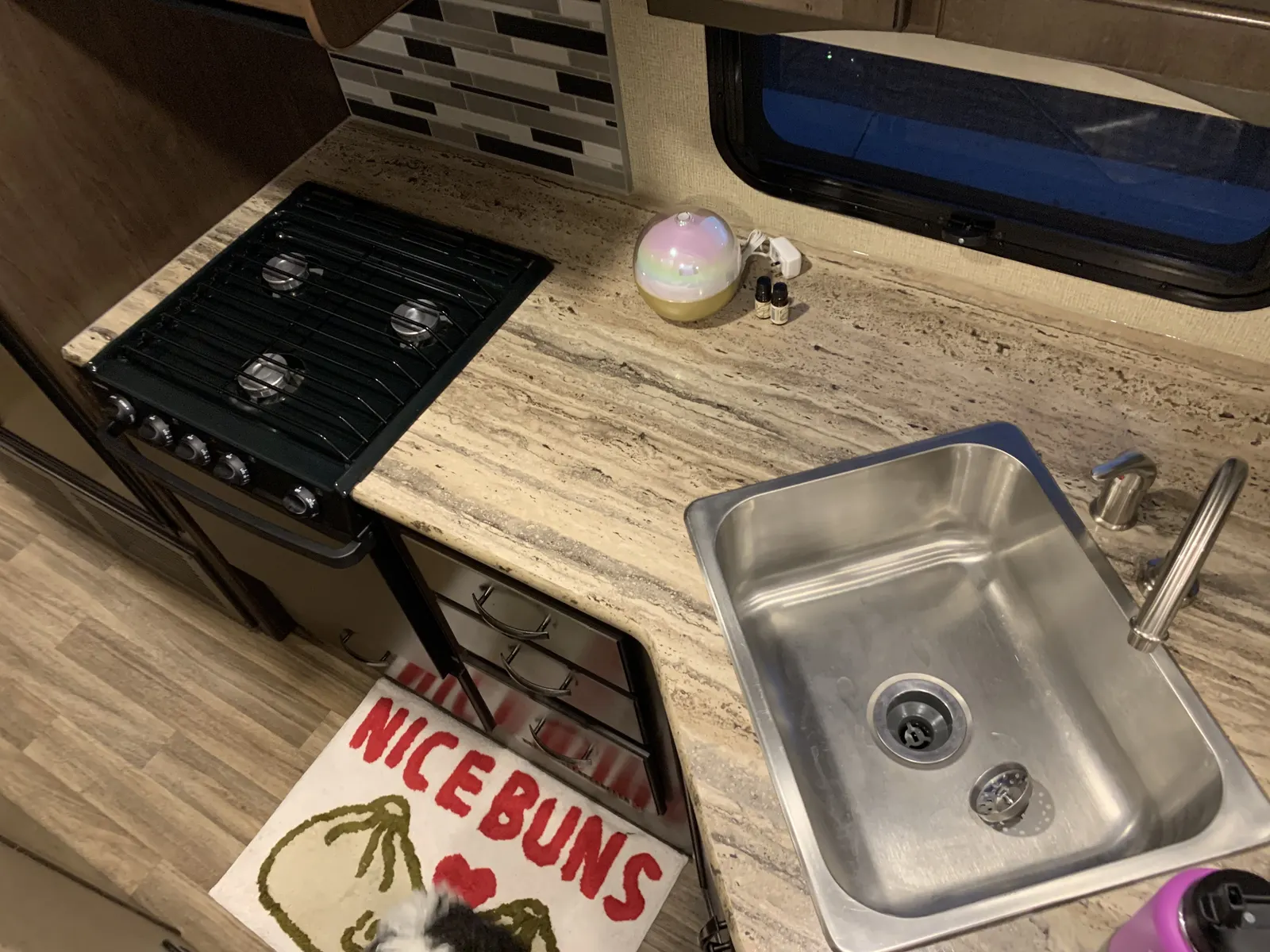 Kitchen with gas stove and sink