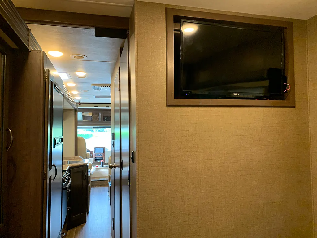 Hallway with wall-mounted TV