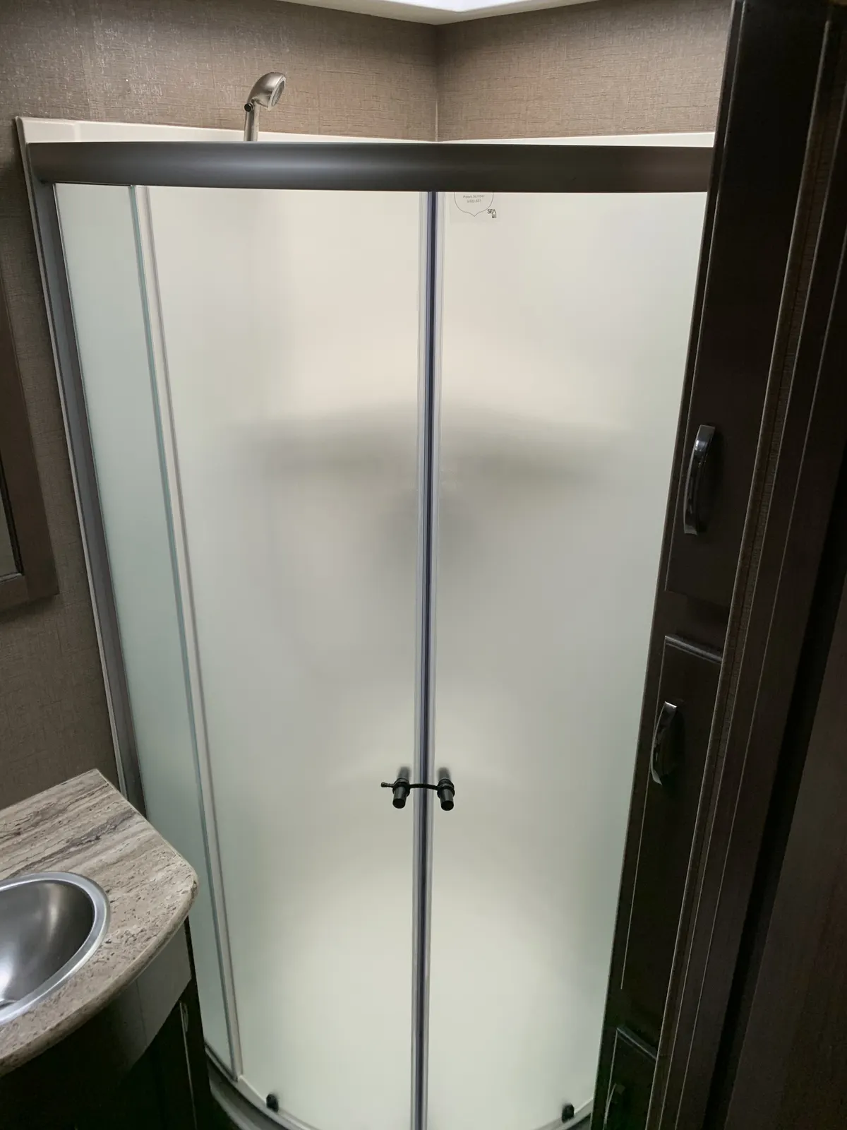 Full-size shower with skylight